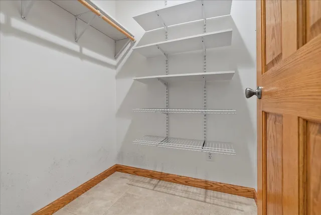 a view of an empty walk in closet