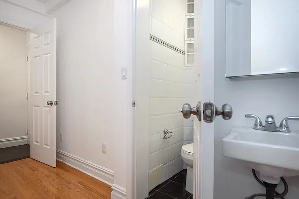 a bathroom with a sink toilet and vanity