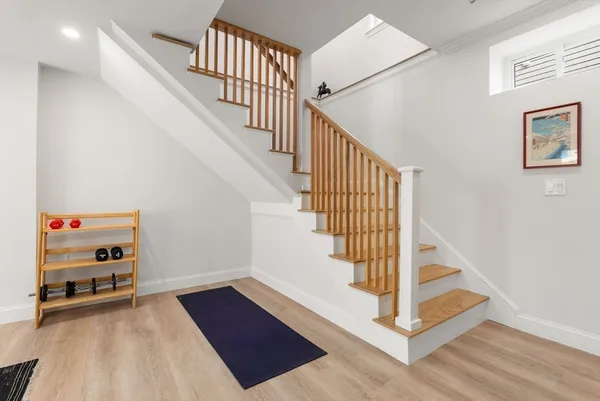 a view of entryway with stairs and wooden floor
