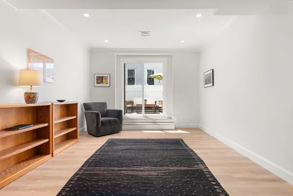 a living room with furniture and a rug