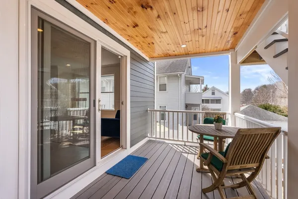 a view of a balcony with furniture