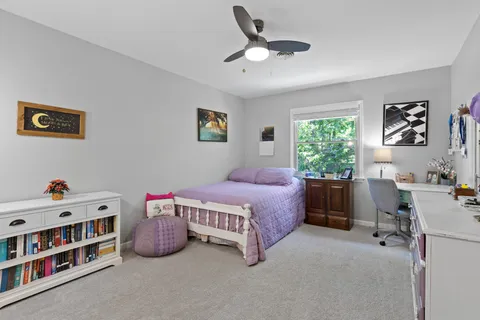 a bedroom with a bed furniture and a window