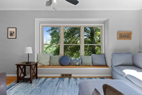 a living room with furniture and a window