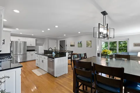a view of a dining room with furniture window and outside view