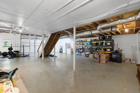 a view of parking garage with cars