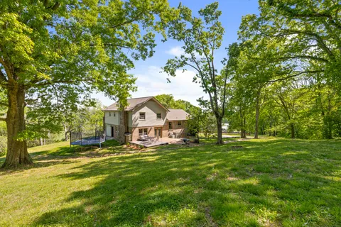 a view of a house with a big yard