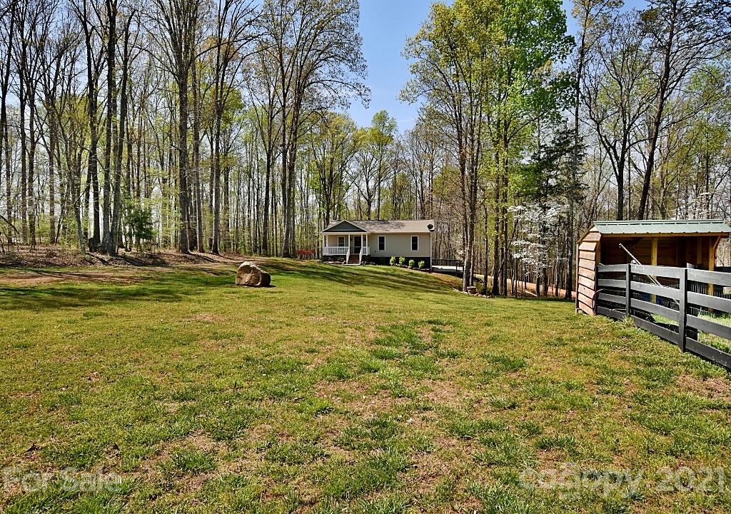 2087 Mission Road York, SC 29745 - Photo 2 of 30 a backyard of a house with barbeque oven and outdoor seating