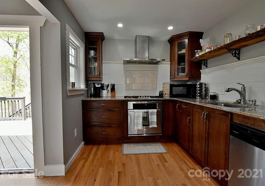 2087 Mission Road York, SC 29745 - Photo 12 of 30 a kitchen with wooden floors and a sink