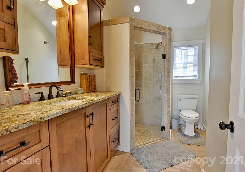 2087 Mission Road York, SC 29745 - Photo 15 of 30 a bathroom with a granite countertop sink toilet and shower