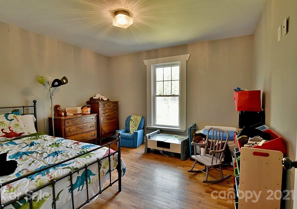 2087 Mission Road York, SC 29745 - Photo 16 of 30 a bedroom with a bed and wooden floor