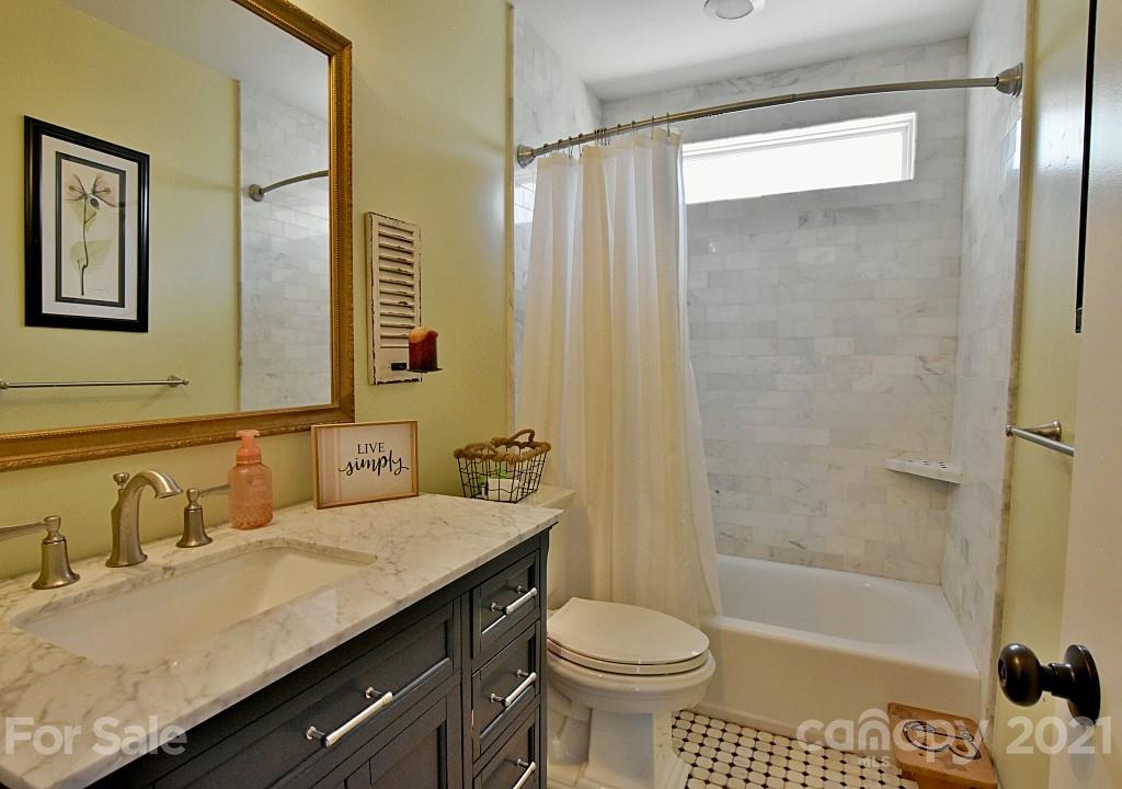 2087 Mission Road York, SC 29745 - Photo 17 of 30 a bathroom with a sink a toilet and shower