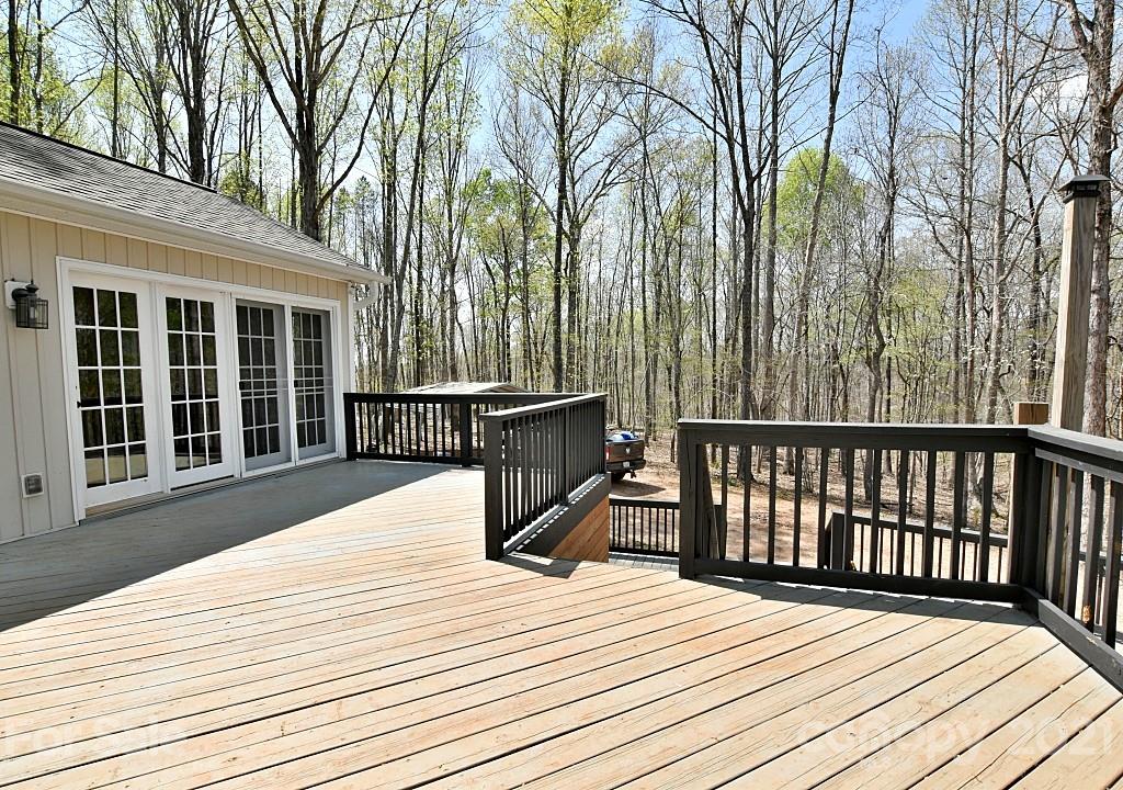 2087 Mission Road York, SC 29745 - Photo 19 of 30 a balcony with wooden floor and fence