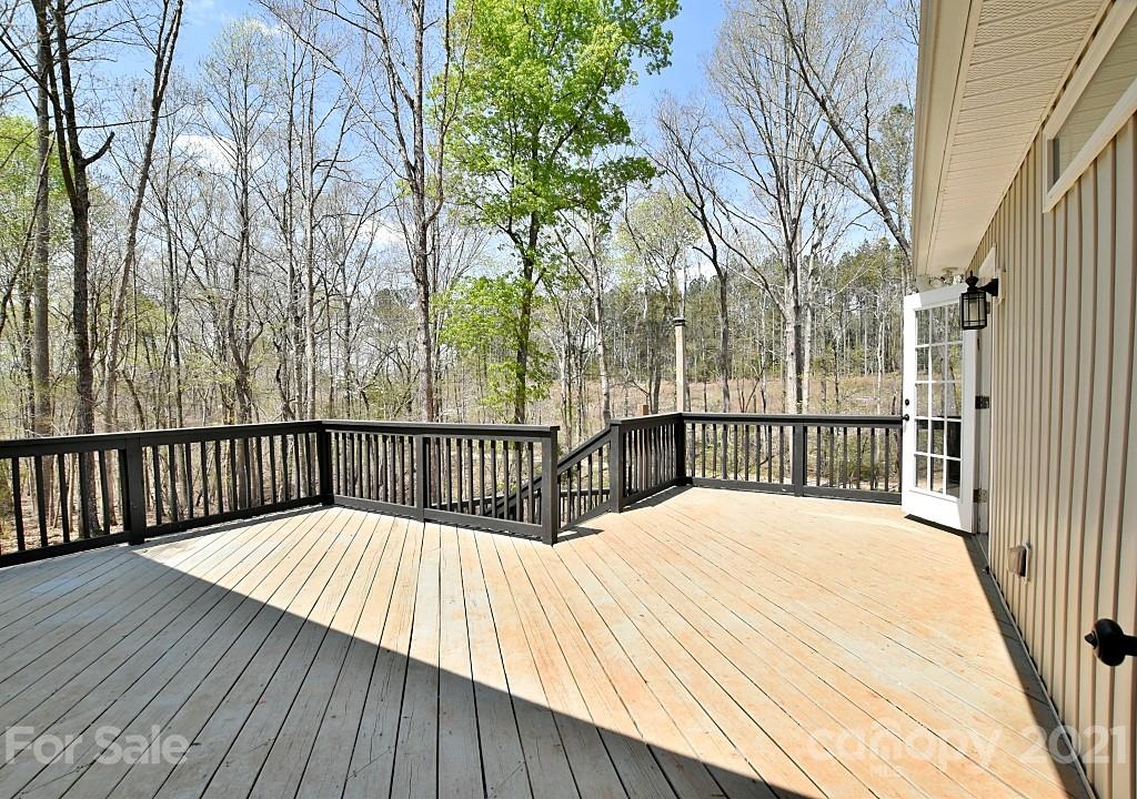 2087 Mission Road York, SC 29745 - Photo 20 of 30 a balcony with wooden floor and fence