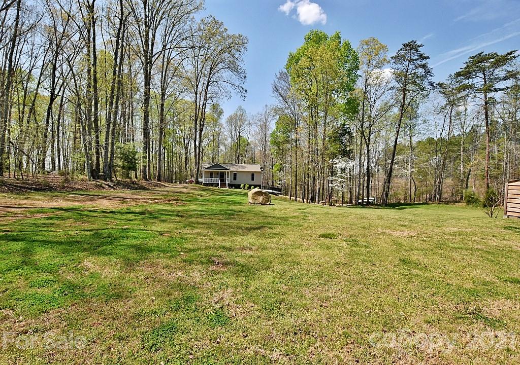 2087 Mission Road York, SC 29745 - Photo 3 of 30 a backyard of a house with lots of green space and fountain