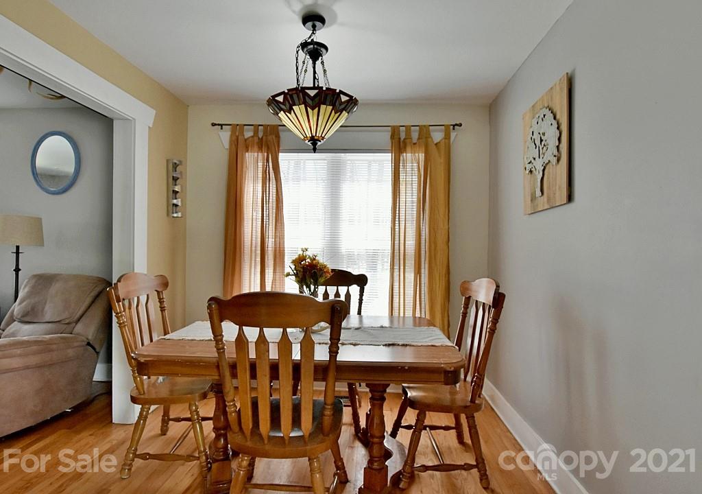 2087 Mission Road York, SC 29745 - Photo 9 of 30 a view of a dining room with furniture window and wooden floor