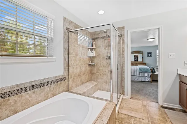 a en suite spacious bathroom with a shower and a bathtub