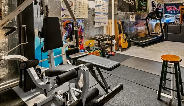 a view of gym equipment with equipment