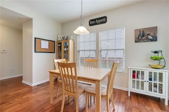 a workspace with furniture window and wooden floor