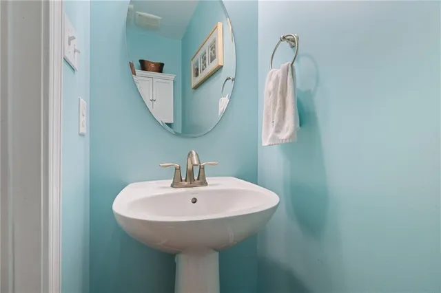 a bathroom with a sink and mirror