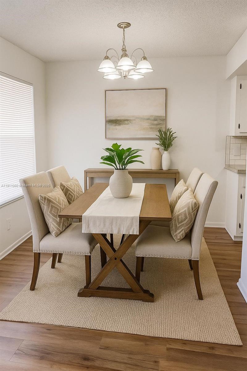 227 Castlewood Drive, Unit 102 North Palm Beach, FL 33408 - Photo 11 of 26 a view of livingroom and dining room with furniture