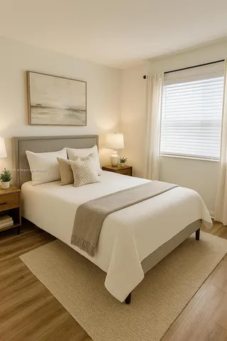 a bedroom with a bed and a night stand