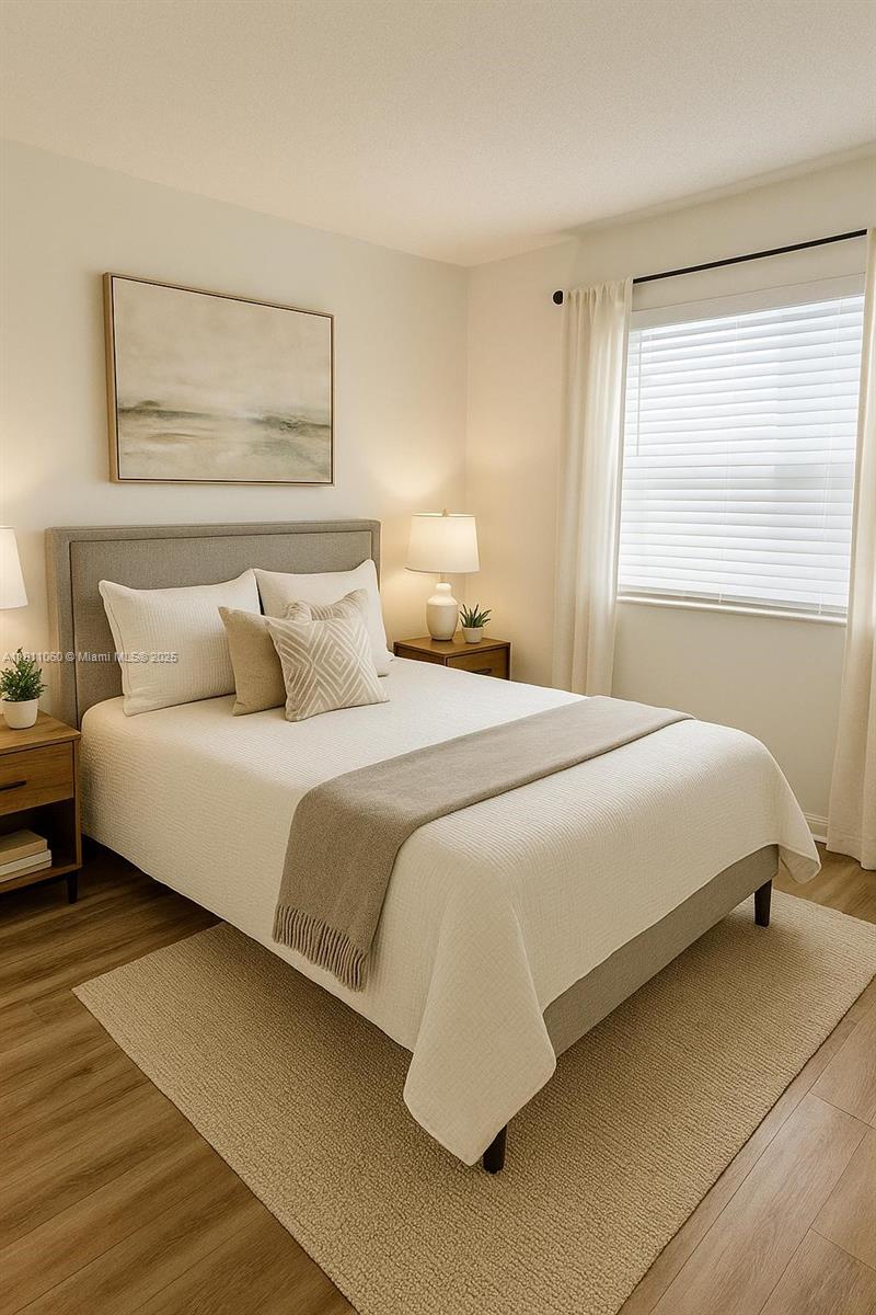 227 Castlewood Drive, Unit 102 North Palm Beach, FL 33408 - Photo 15 of 26 a bedroom with a bed and a night stand