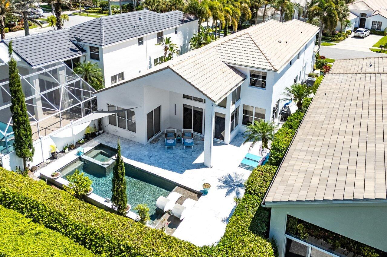 3395 Northwest 53rd Circle Boca Raton, FL 33496 - Photo 26 of 64 an aerial view of a house with swimming pool and sitting area