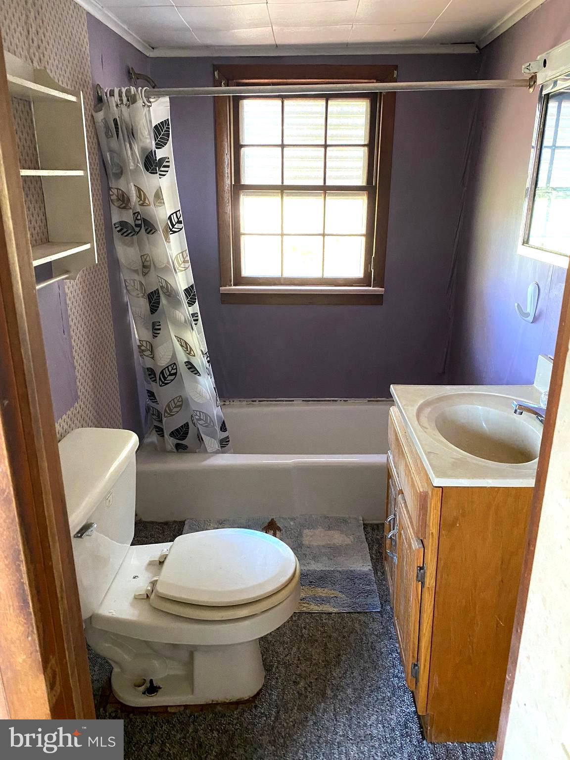 3251 Marsh Road Ewell, MD 21824 - Photo 18 of 23 a bathroom with a sink a toilet a tub and shower