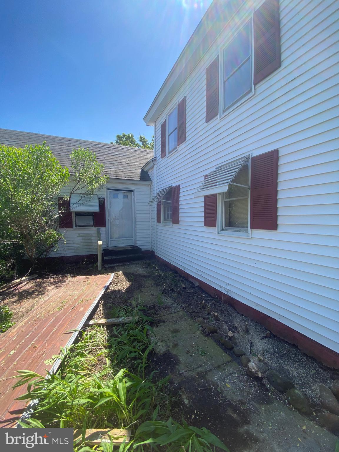 3251 Marsh Road Ewell, MD 21824 - Photo 2 of 23 a backyard of a house with yard and outdoor seating