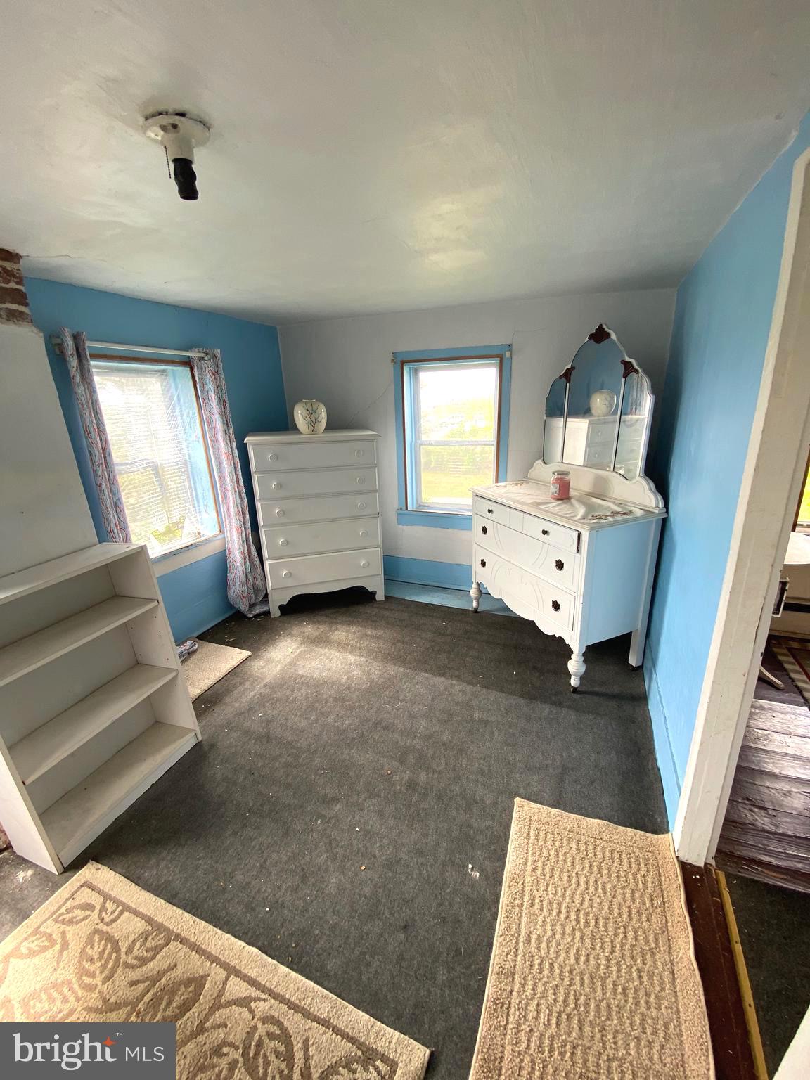 3251 Marsh Road Ewell, MD 21824 - Photo 23 of 23 a living room with furniture and a wooden floor