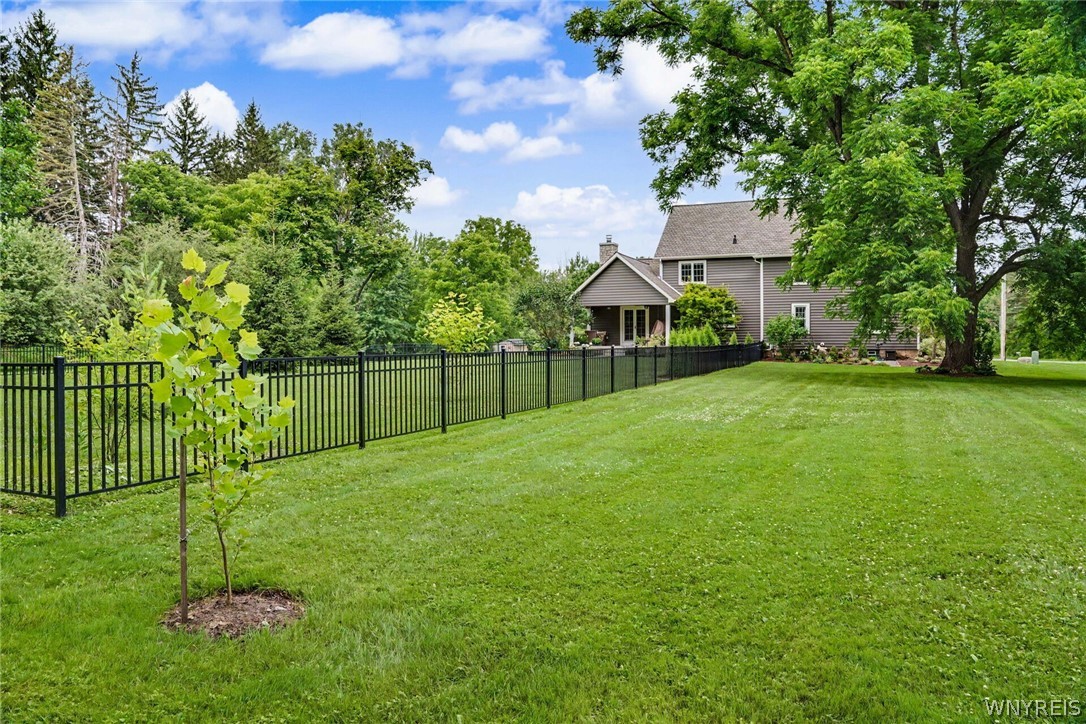 6600 Dye Road Newstead, NY 14001 - Photo 11 of 50 Front ground angle showcasing aluminum fenced-in area