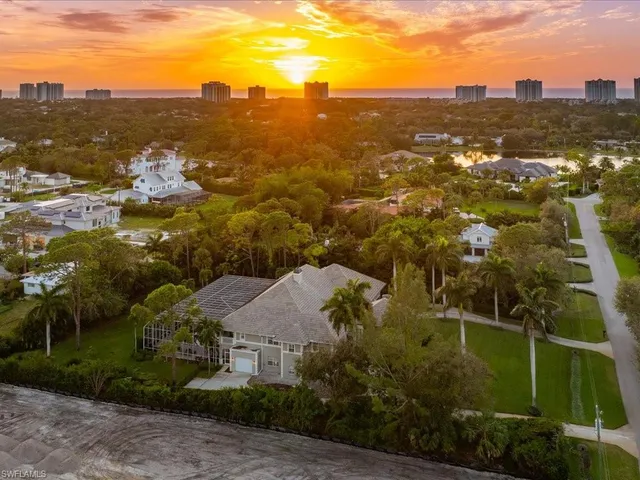 an aerial view of residential houses with city view and lake view
