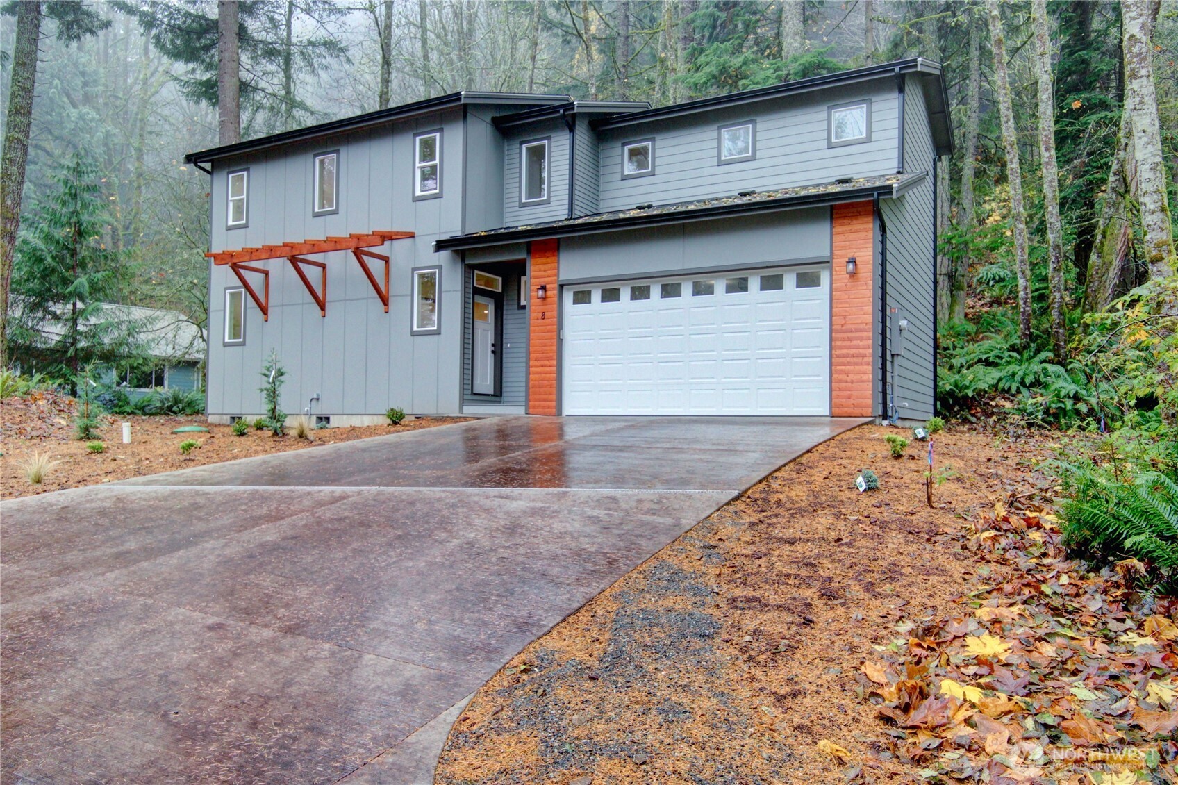 a front view of a house with garage