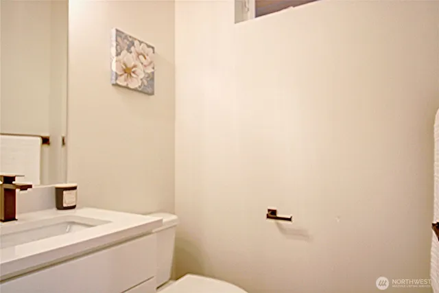 a view of a small space with wooden floor and a window