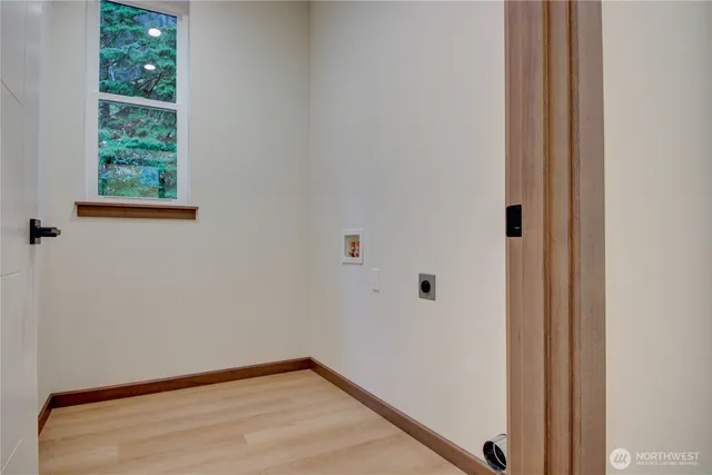 a view of a livingroom with furniture and stairs