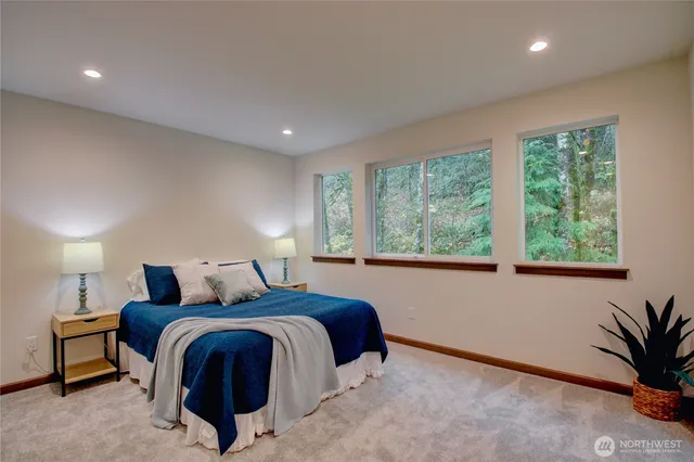 a bedroom with a bed and a lamp