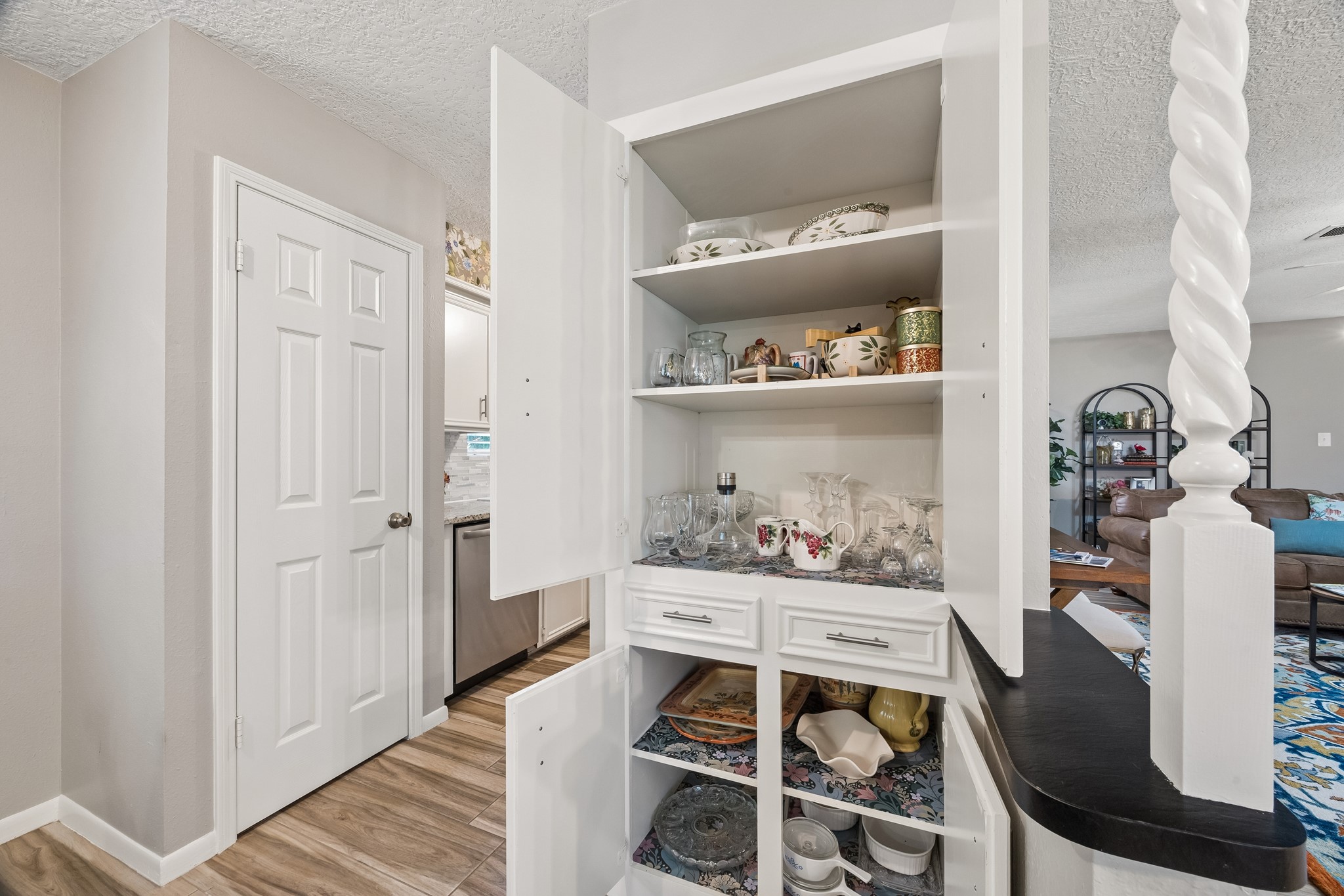 2102 Casa Rio Circle Dickinson, TX 77539 - Photo 8 of 22 Custom built-in cabinetry showcases abundant storage and organization options—a valuable feature rarely found in condominium homes. Absolutely stunning!!!