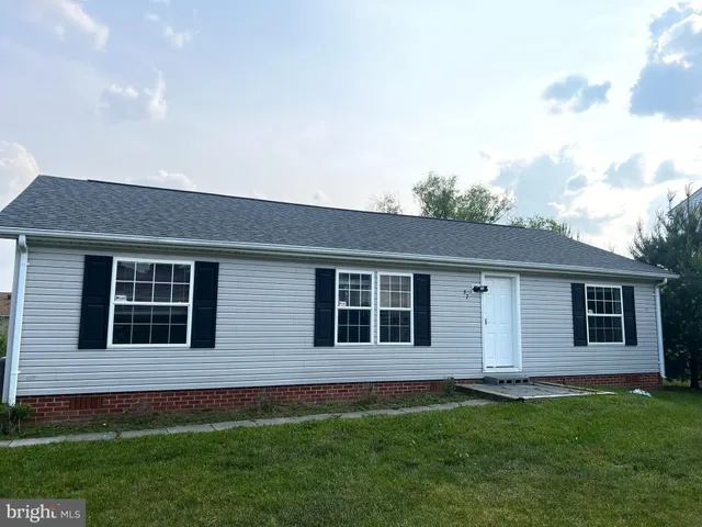 a house view with a garden space