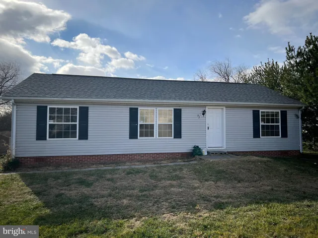 a front view of house with yard