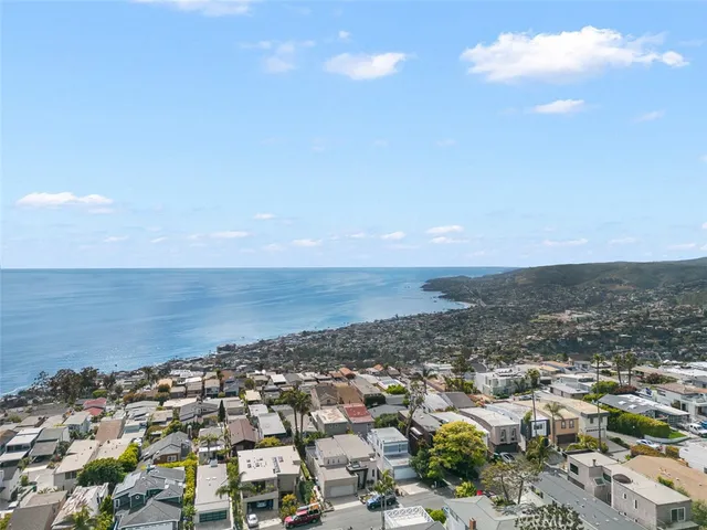a roof deck with patio table and chairs