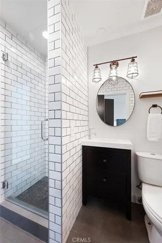 a view of living room kitchen with furniture and wooden floor