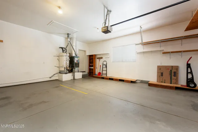 a view of a garage with wooden fence
