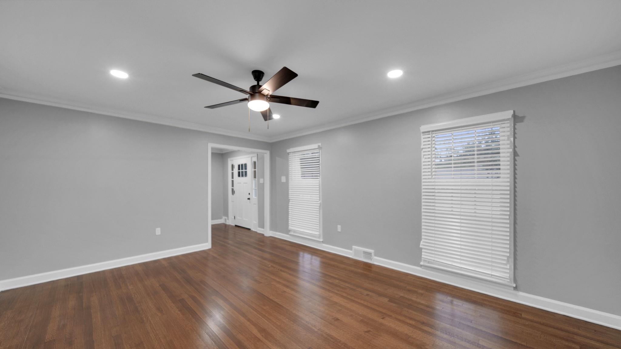 5256 Collingwood Road Memphis, TN 38117 - Photo 11 of 40 Empty room featuring ornamental molding, dark wood-type flooring, recessed lighting, and ceiling fan