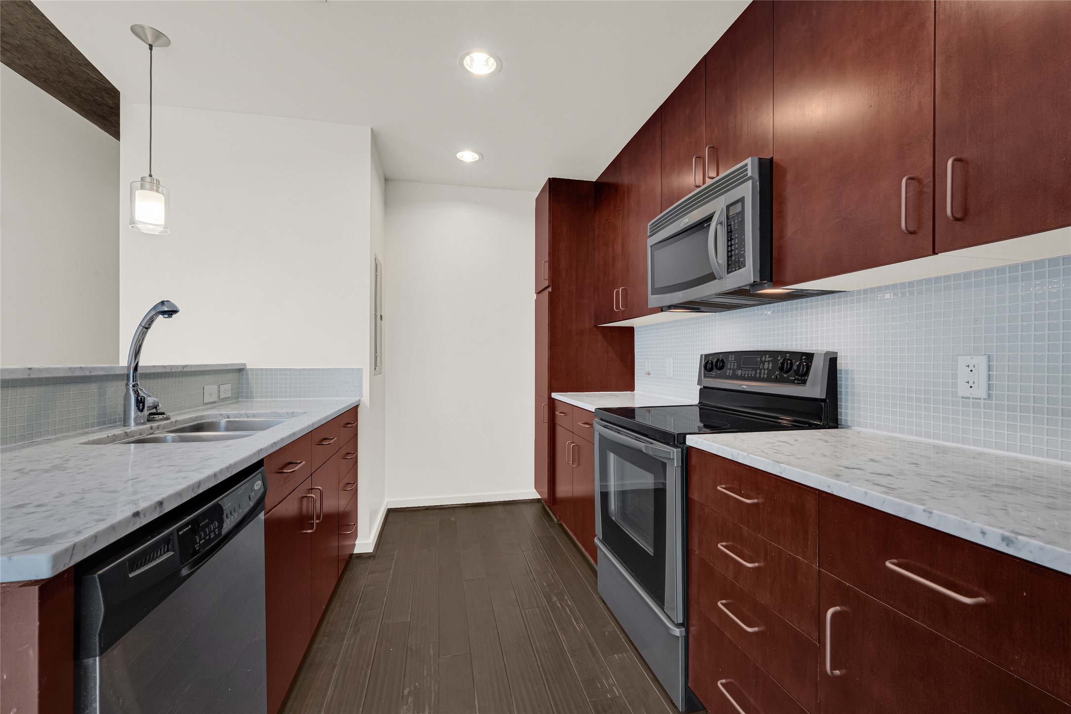 5925 Almeda Road, Unit 12308 Houston, TX 77004 - Photo 2 of 48 a kitchen with stainless steel appliances granite countertop a sink a stove and a refrigerator
