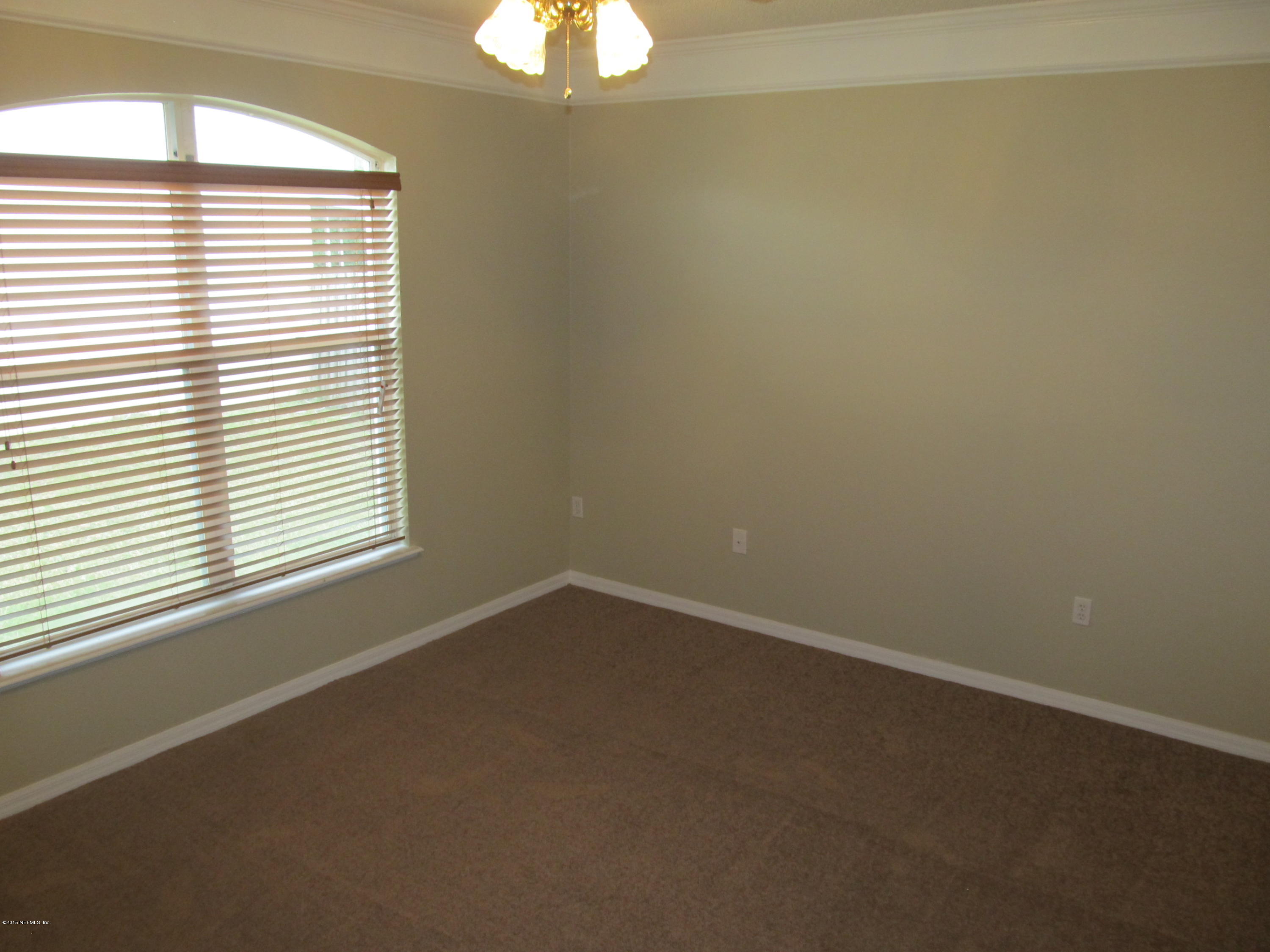 7079 Prosperity Park Road East Jacksonville, FL 32244 - Photo 11 of 22 an empty room with a window