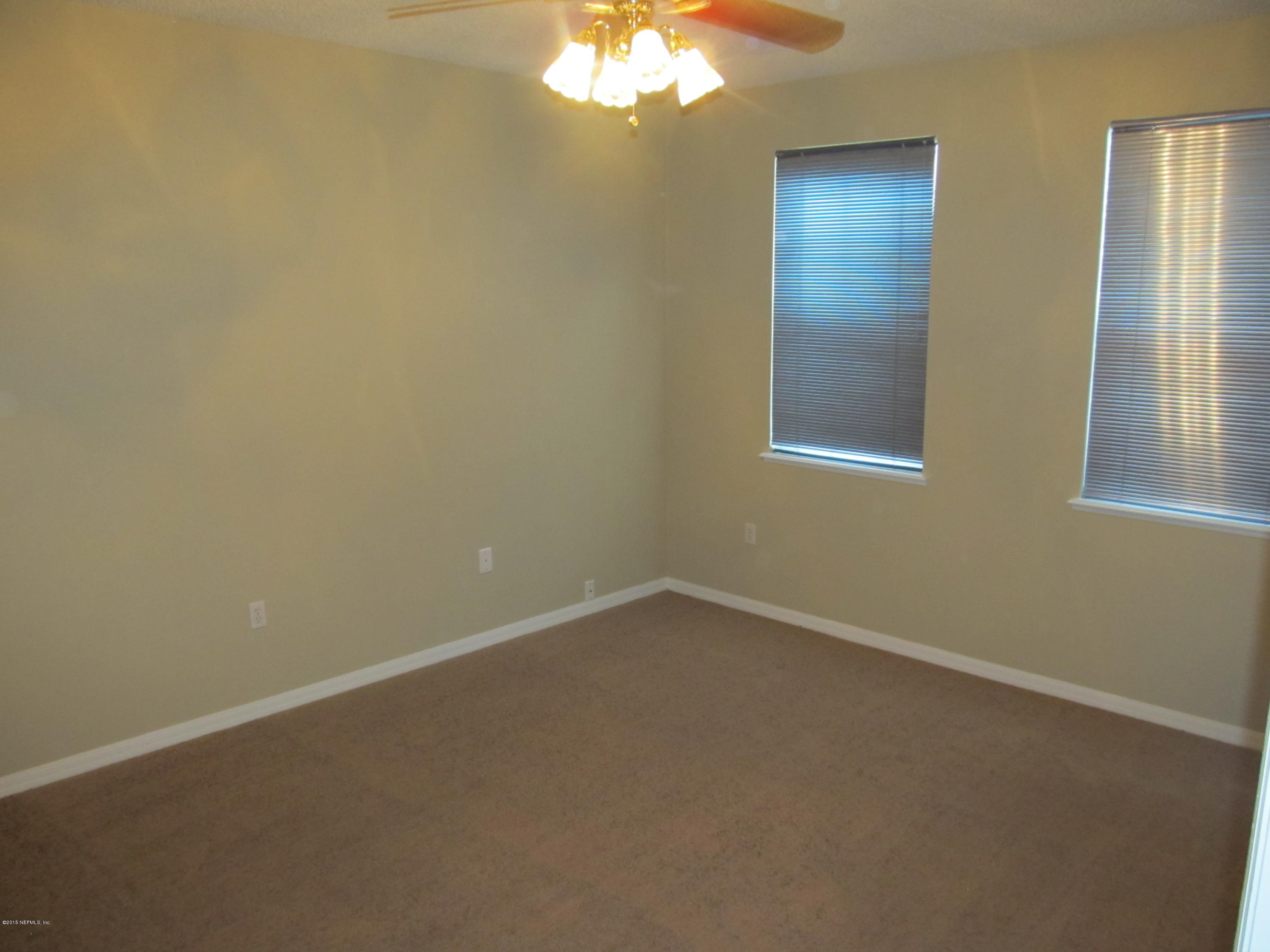 7079 Prosperity Park Road East Jacksonville, FL 32244 - Photo 12 of 22 an empty room with a window