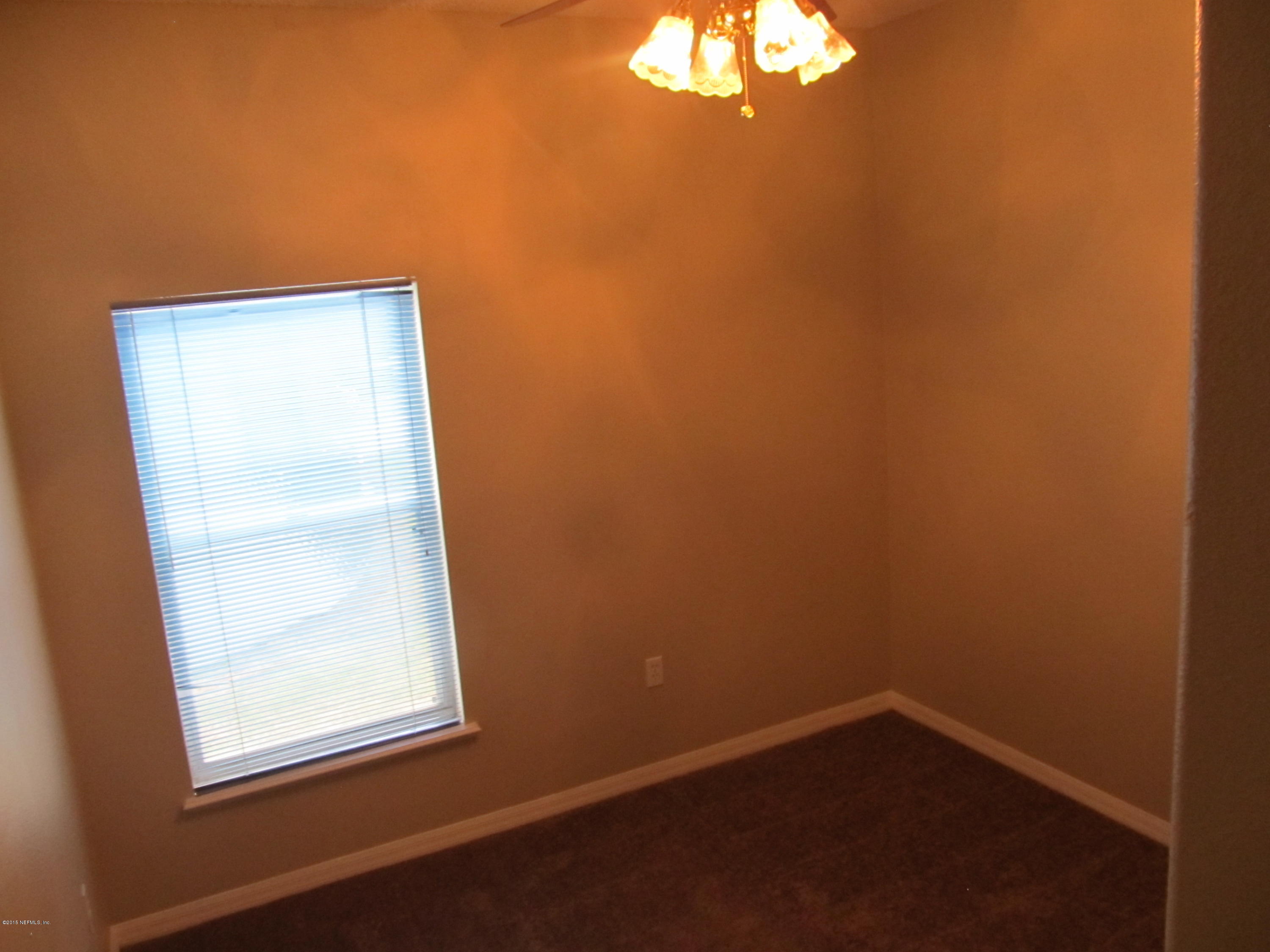 7079 Prosperity Park Road East Jacksonville, FL 32244 - Photo 18 of 22 an empty room with a window