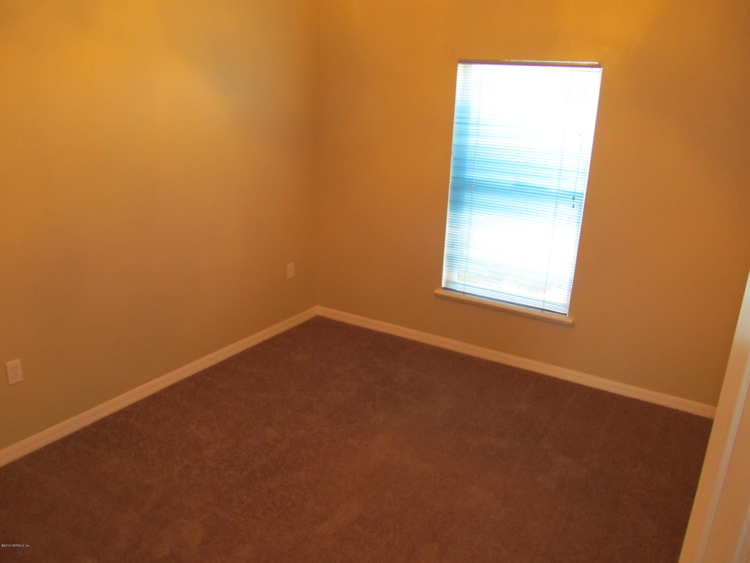7079 Prosperity Park Road East Jacksonville, FL 32244 - Photo 19 of 22 an empty room with a window