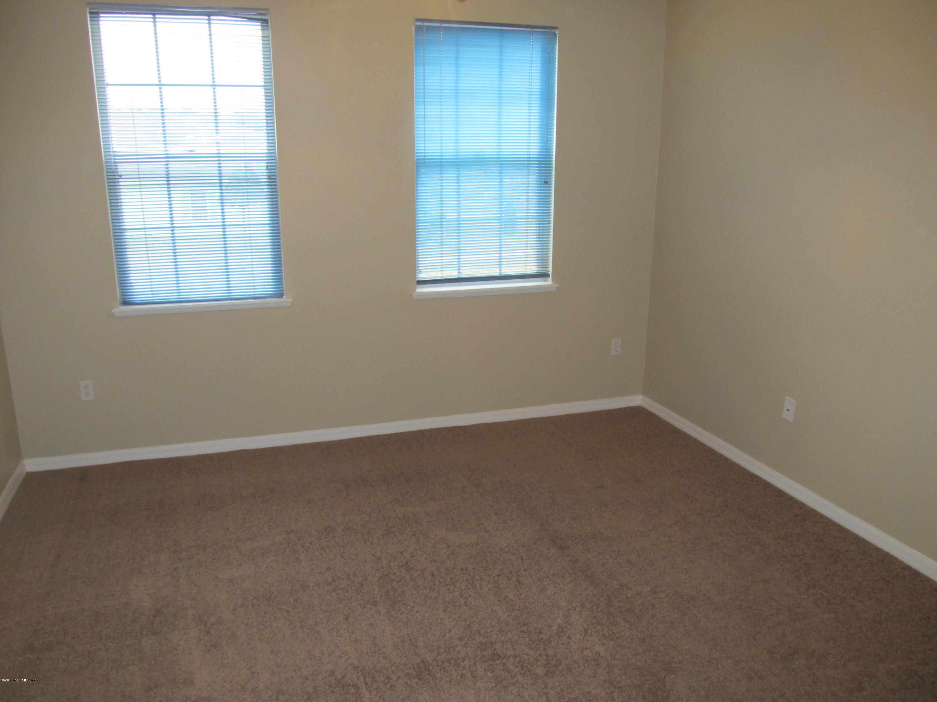 7079 Prosperity Park Road East Jacksonville, FL 32244 - Photo 20 of 22 an empty room with windows