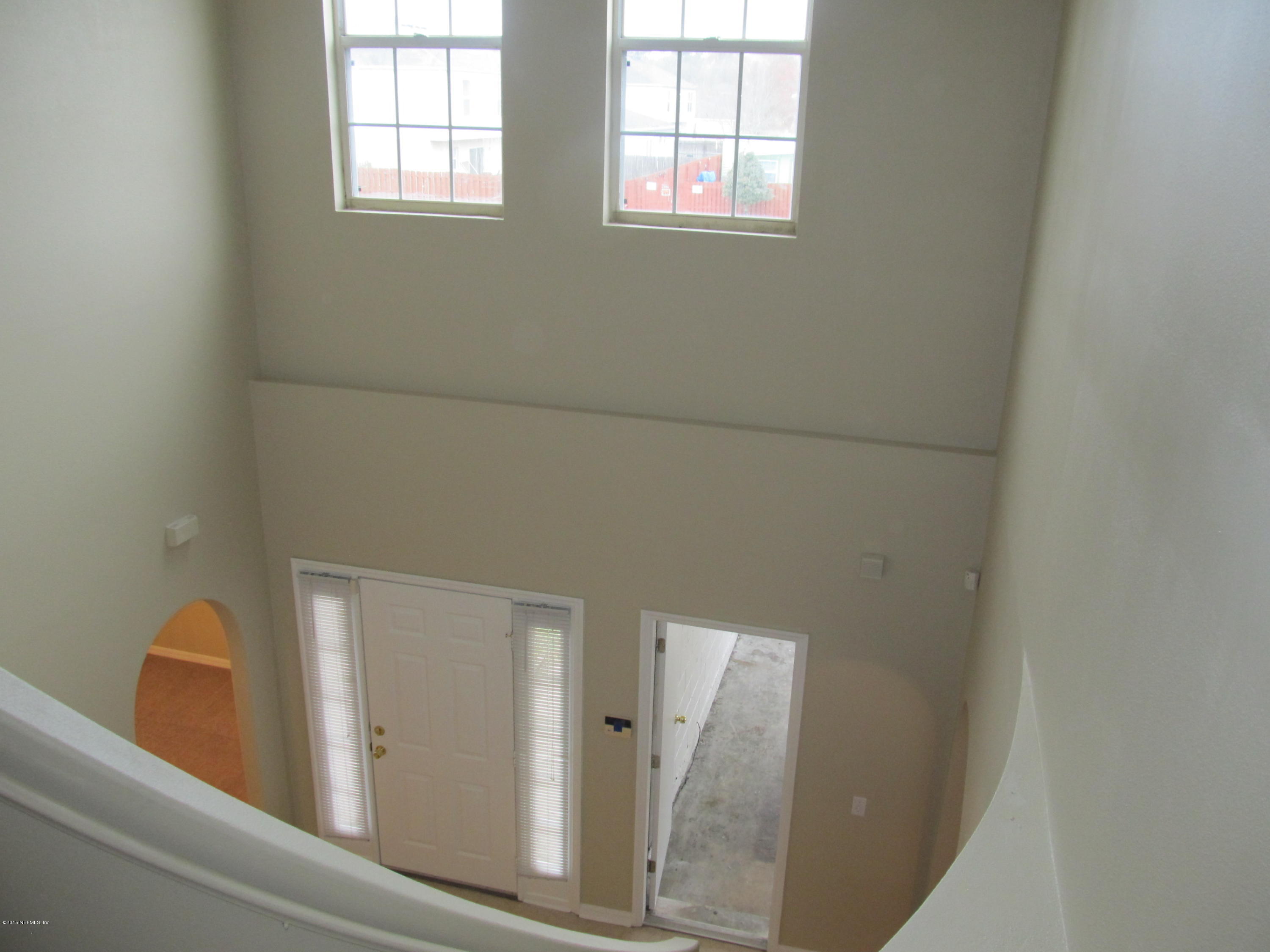 7079 Prosperity Park Road East Jacksonville, FL 32244 - Photo 4 of 22 a view of a hallway with windows